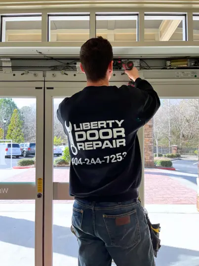 Commercial door repair service performed by a Liberty Door Repair technician in Alpharetta.