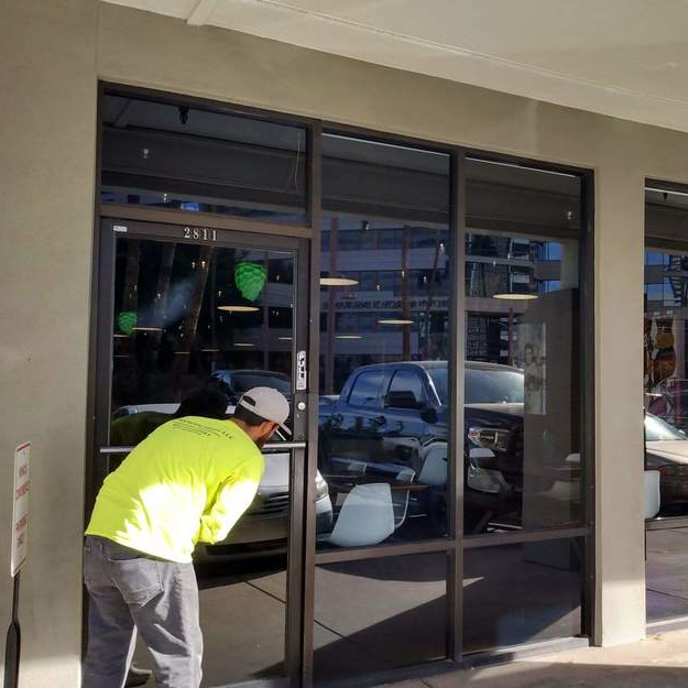 Liberty Door Repair technician performing storefront door repair for a client in Metro Atlanta.