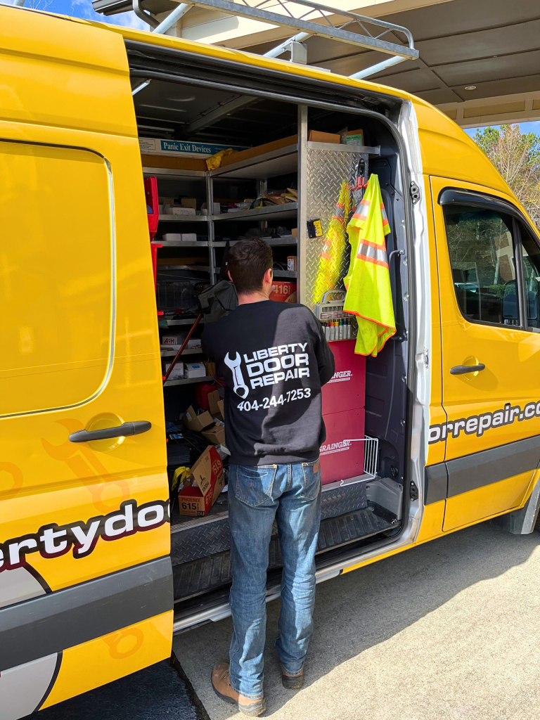 Liberty Door Repair Technician On-Site with Service Van Offering Commercial and Residential Door Repair